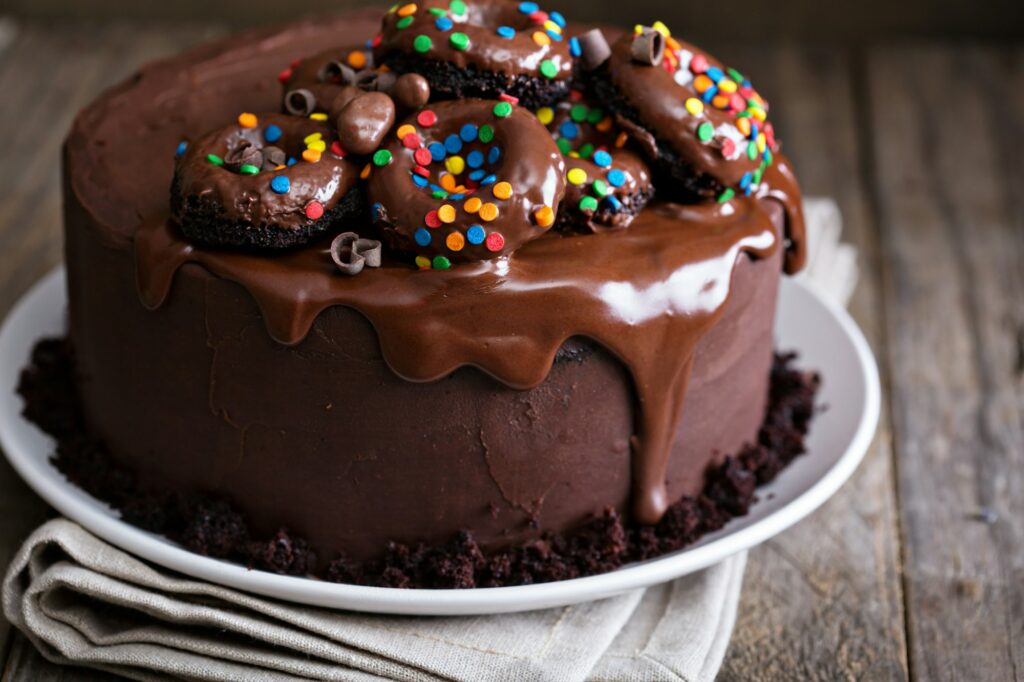 Chocolate cake decorated with donuts