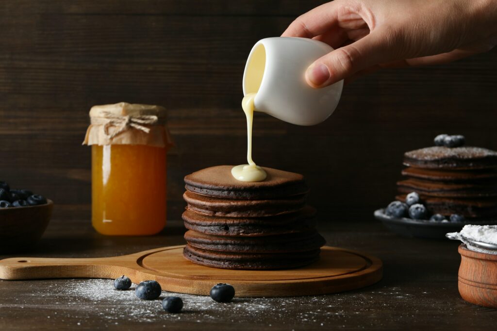 Concept of sweet food, tasty chocolate pancakes