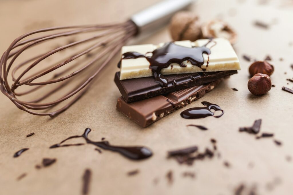 Delicious chocolate bars with melted chocolate