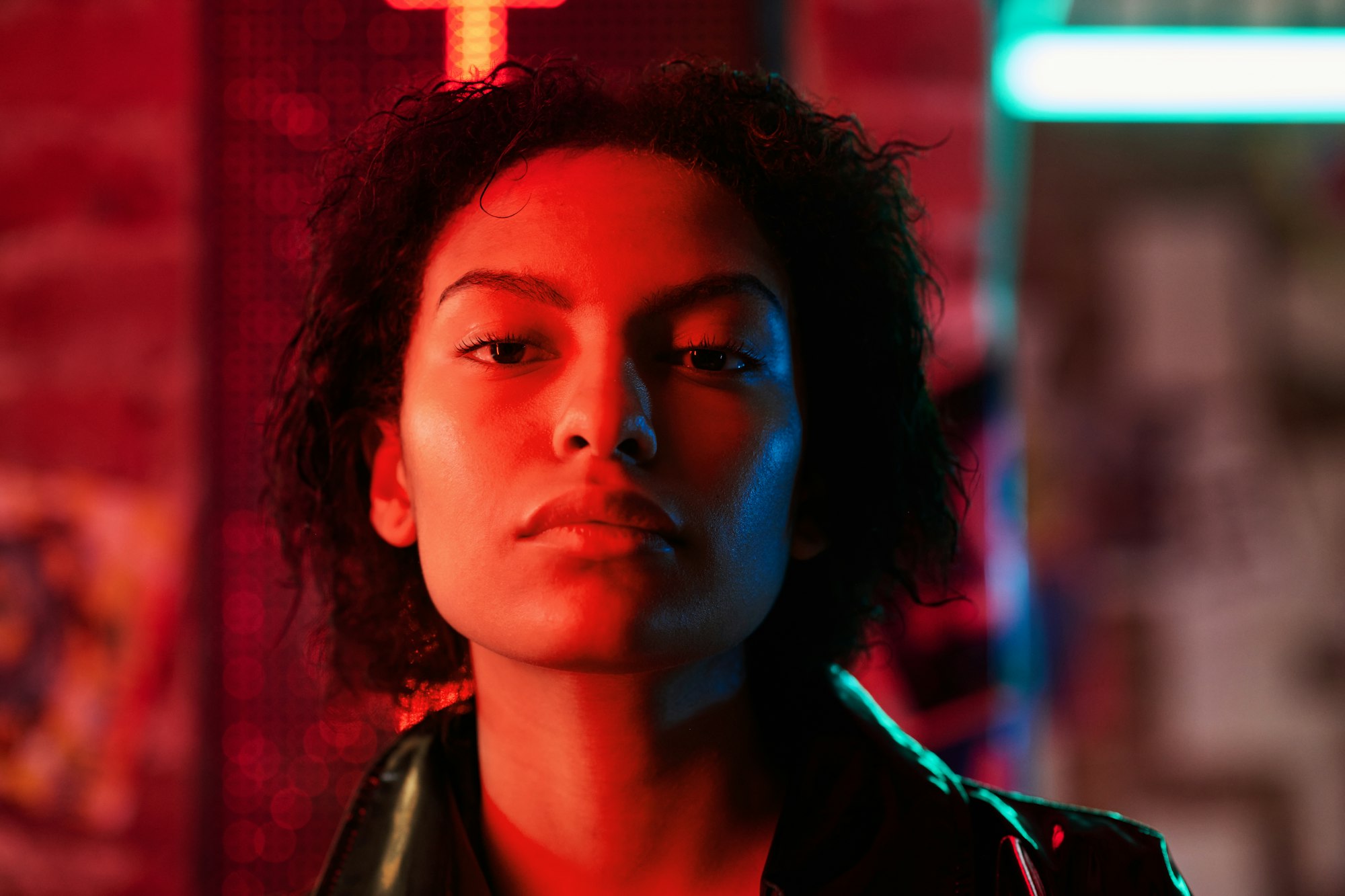 Face of young African American woman with short hair looking at camera