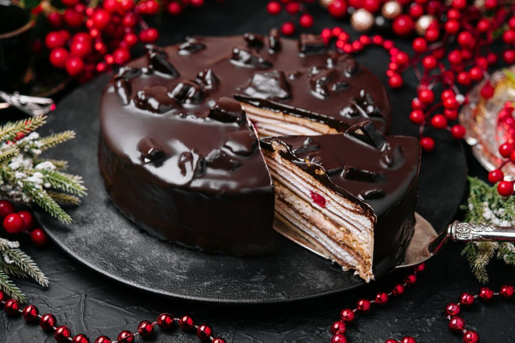 Freshly made delicious chocolate cake on marble table