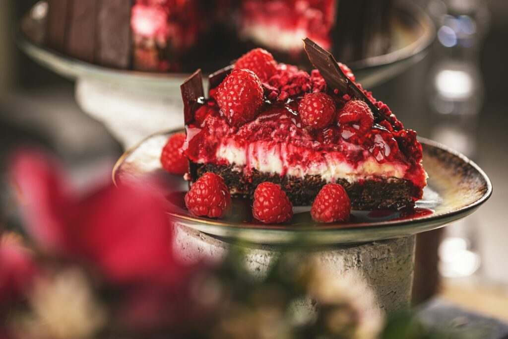 Slice of chocolate cake with raspberries